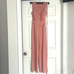 Beautiful blush pink lace jump suit from fashion nova